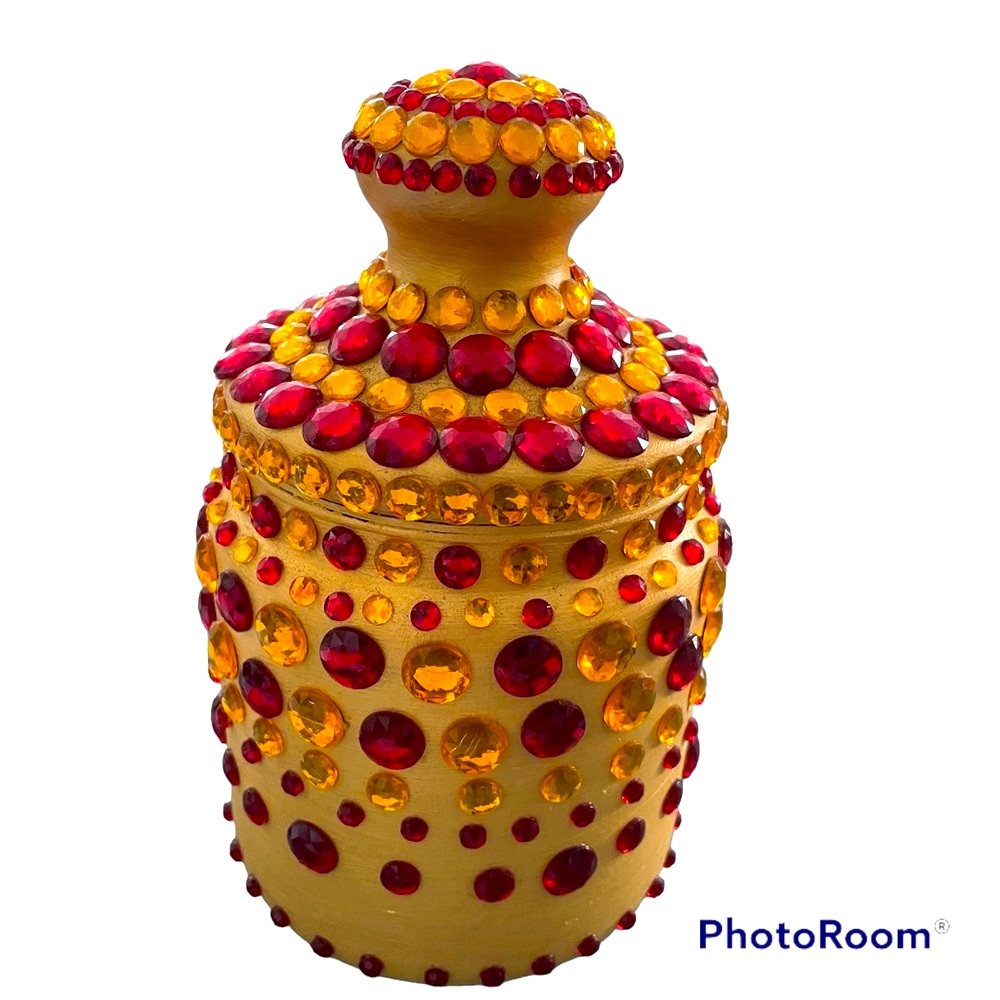 Hand decorated jar with cover embellished with ornaments. Gold Red and Yellow
